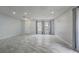 Bright and airy living room with modern tile flooring and lots of natural light at 1455 Blue Horizon Dr, Clermont, FL 34714