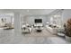 Open-concept living room featuring a dining area and a sitting area with neutral decor at 1455 Blue Horizon Dr, Clermont, FL 34714