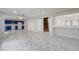 Expansive living area featuring tile flooring and an open layout with modern lighting at 1455 Blue Horizon Dr, Clermont, FL 34714