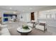 Open concept living space with dining area, kitchen, and a staircase at 1455 Blue Horizon Dr, Clermont, FL 34714