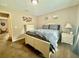 A well-lit bedroom with carpet, a window, closet doors, and soothing wall decor at 14598 Se 28Th Ct, Summerfield, FL 34491