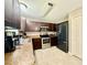 Efficient kitchen with dark cabinets, stainless steel appliances, and tile flooring at 14598 Se 28Th Ct, Summerfield, FL 34491