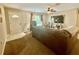 Cozy living room with neutral walls, carpet flooring, and a ceiling fan at 14598 Se 28Th Ct, Summerfield, FL 34491