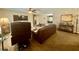 Spacious living area with carpet floors and multiple seating options at 14598 Se 28Th Ct, Summerfield, FL 34491