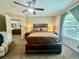 This main bedroom boasts a ceiling fan and a spacious layout with neutral paint at 14598 Se 28Th Ct, Summerfield, FL 34491
