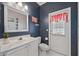 Bathroom with unique decor, single vanity, and tiled floors at 14848 Bonnybridge Dr, Orlando, FL 32826