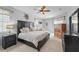 Cozy bedroom featuring a large bed, stylish furniture, and soft lighting at 14848 Bonnybridge Dr, Orlando, FL 32826