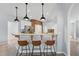 Kitchen bar with granite countertops, pendant lighting, and seating for three at 14848 Bonnybridge Dr, Orlando, FL 32826