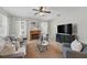 Cozy living room featuring a fireplace, plush seating, and a neutral color palette at 14848 Bonnybridge Dr, Orlando, FL 32826