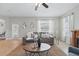 Comfortable living room with neutral décor, decorative mirrors, and bright natural light at 14848 Bonnybridge Dr, Orlando, FL 32826