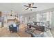 Spacious living room with tile floors, neutral walls, and comfortable seating arrangement at 14848 Bonnybridge Dr, Orlando, FL 32826
