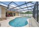 Inviting screened-in pool offers a refreshing escape with a lounge area and ample space for outdoor enjoyment at 14848 Bonnybridge Dr, Orlando, FL 32826
