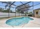 A serene swimming pool enclosed with a screen is nestled in a private yard, perfect for summer refreshment at 14848 Bonnybridge Dr, Orlando, FL 32826