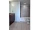 Elegant bathroom featuring a shower-over-tub with granite vanity top at 155 S Court Ave # 2403, Orlando, FL 32801