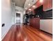 Modern kitchen features stainless steel appliances, wood cabinets, and hardwood flooring at 155 S Court Ave # 2403, Orlando, FL 32801