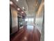 Modern kitchen features stainless steel appliances, wood cabinets, and hardwood flooring at 155 S Court Ave # 2403, Orlando, FL 32801