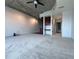 Open-concept living space with plush gray carpeting and ceiling fan at 155 S Court Ave # 2403, Orlando, FL 32801