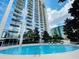Relax in the sunshine by the beautiful in-ground community swimming pool at 155 S Court Ave # 2403, Orlando, FL 32801