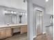Bright bathroom featuring dual sinks, generous counter space, and a framed glass shower at 1802 Imperial Palm Dr, Apopka, FL 32712