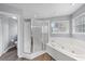 Bright and airy bathroom features a standalone shower and separate jetted tub at 1802 Imperial Palm Dr, Apopka, FL 32712