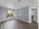 Bright bedroom with large window and modern flooring, ready for your personal touch at 1802 Imperial Palm Dr, Apopka, FL 32712