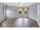 Spacious bedroom with hardwood floors, a ceiling fan, and bright windows at 1802 Imperial Palm Dr, Apopka, FL 32712