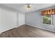 A simply-designed bedroom with a ceiling fan, two closets, and a single window at 1802 Imperial Palm Dr, Apopka, FL 32712
