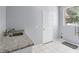 Clean laundry room with granite countertop sink and white tiled floors at 1802 Imperial Palm Dr, Apopka, FL 32712
