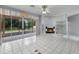 Spacious living room with tile flooring, a fireplace, and glass sliding doors to the lanai at 1802 Imperial Palm Dr, Apopka, FL 32712