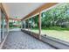 Enclosed screened patio with tile flooring and view of the backyard at 1802 Imperial Palm Dr, Apopka, FL 32712