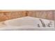 Close-up of the bathtub featuring a white tub and chrome faucet at 1942 Michael Tiago Cir, Maitland, FL 32751