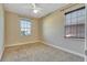 Bedroom with neutral carpet, ceiling fan, and windows that provide plenty of natural light at 1942 Michael Tiago Cir, Maitland, FL 32751