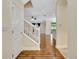 Inviting entryway featuring hardwood floors, white trim, and a staircase leading to the upper level at 1942 Michael Tiago Cir, Maitland, FL 32751
