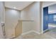 Bright hallway with carpet flooring, neutral walls, and an open doorway to a bedroom at 1942 Michael Tiago Cir, Maitland, FL 32751