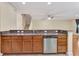 Open-concept kitchen featuring granite countertops, stainless steel appliances, and custom cabinetry at 1942 Michael Tiago Cir, Maitland, FL 32751
