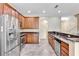 Beautiful kitchen with stainless steel appliances, granite countertops, and hardwood cabinets at 1942 Michael Tiago Cir, Maitland, FL 32751