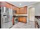 Well-equipped kitchen boasts stainless steel appliances, granite countertops, and custom wood cabinets at 1942 Michael Tiago Cir, Maitland, FL 32751