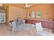 Poolside grill area with stainless steel grill, counter space, and seating for entertaining at 1942 Michael Tiago Cir, Maitland, FL 32751