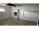 Neutral bedroom showcasing a ceiling fan, window, and a closet for storage at 1985 Japonica Rd, Winter Park, FL 32792