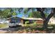 Charming single-story home with a two-car garage and mature landscaping at 1985 Japonica Rd, Winter Park, FL 32792