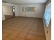 Bright living room featuring tile flooring, a window, and a neutral color scheme at 1985 Japonica Rd, Winter Park, FL 32792