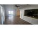 Living area featuring tile flooring, a ceiling fan, and sliding glass doors at 1985 Japonica Rd, Winter Park, FL 32792
