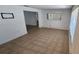 Bright living room featuring tile flooring and a large window for natural light at 1985 Japonica Rd, Winter Park, FL 32792
