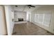 Bright living room featuring tile flooring and a brick fireplace at 1985 Japonica Rd, Winter Park, FL 32792
