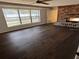 Spacious living room featuring hard wood floors and a large brick fireplace at 1985 Japonica Rd, Winter Park, FL 32792