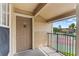 Balcony view of tennis court, showing palm trees and blue skies, a private outdoor space for relaxation and recreation at 2213 Grand Cayman Ct # 1138, Kissimmee, FL 34741