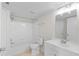 Well-lit bathroom with a tub, shower, white vanity, and framed mirror at 2213 Grand Cayman Ct # 1138, Kissimmee, FL 34741