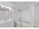 Clean bathroom with white fixtures, tub/shower combination, and bright lighting at 2213 Grand Cayman Ct # 1138, Kissimmee, FL 34741