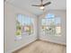 Well-lit bedroom featuring large windows and laminate floors, creating a serene atmosphere for rest and relaxation at 2213 Grand Cayman Ct # 1138, Kissimmee, FL 34741