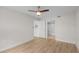 Cozy bedroom featuring a ceiling fan and connected bathroom and closet at 2213 Grand Cayman Ct # 1138, Kissimmee, FL 34741